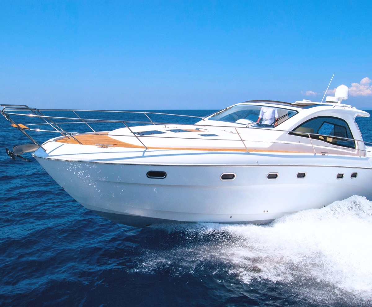 White powerboat cruising on open water for Florida boat loan financing