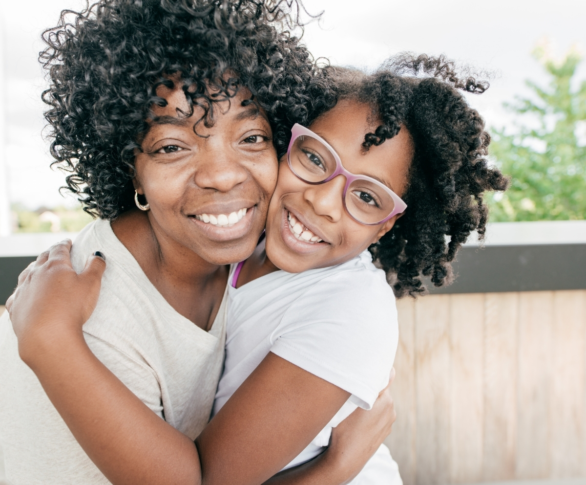 Parent and child representing financial stability through savings-backed borrowing