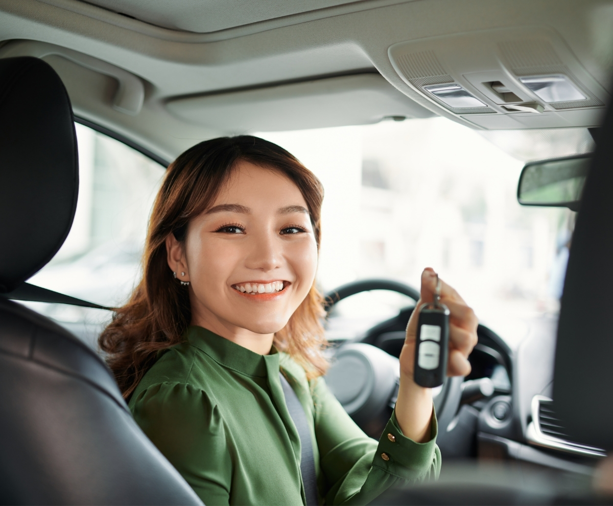 Driver holding car keys after managing auto loan payment flexibility with Skip-A-Pay