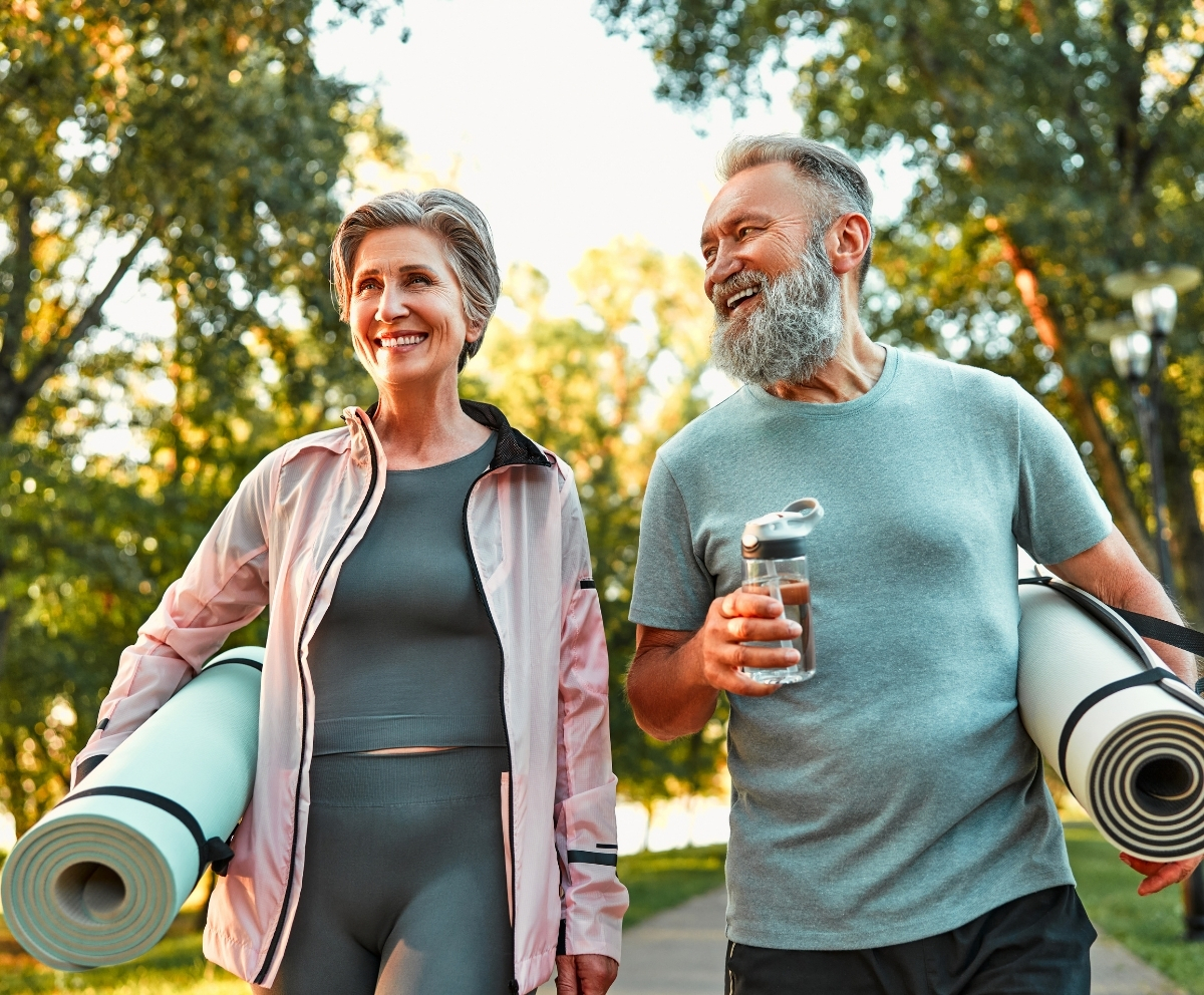 Active couple representing financial stability during retirement and life changes