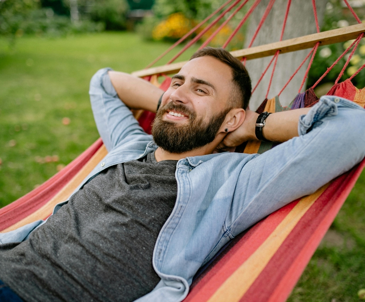 Man relaxing outdoors after using a short-term loan for financial breathing room