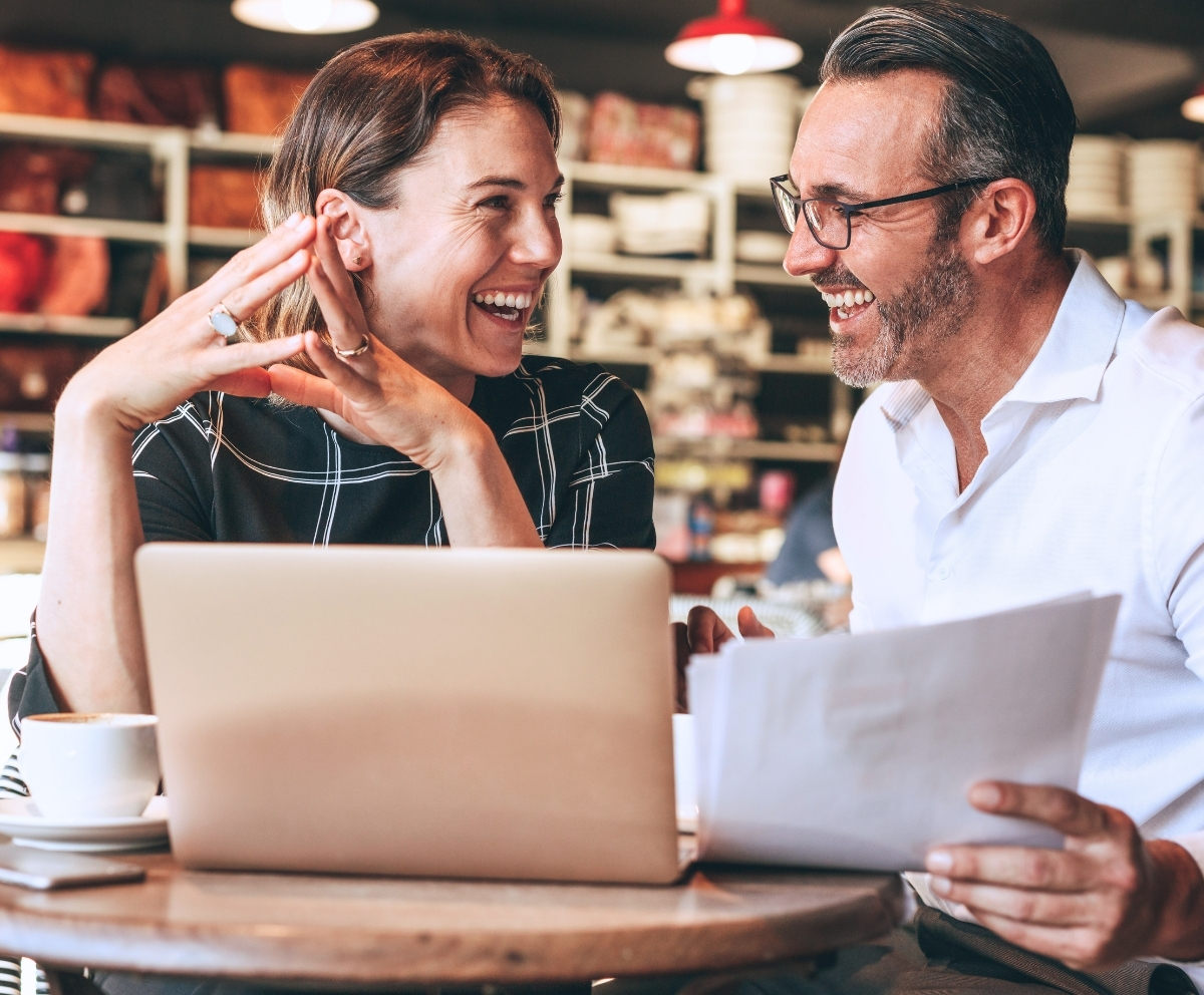 Couple reviewing Certificate of Deposit options and savings goals on a laptop