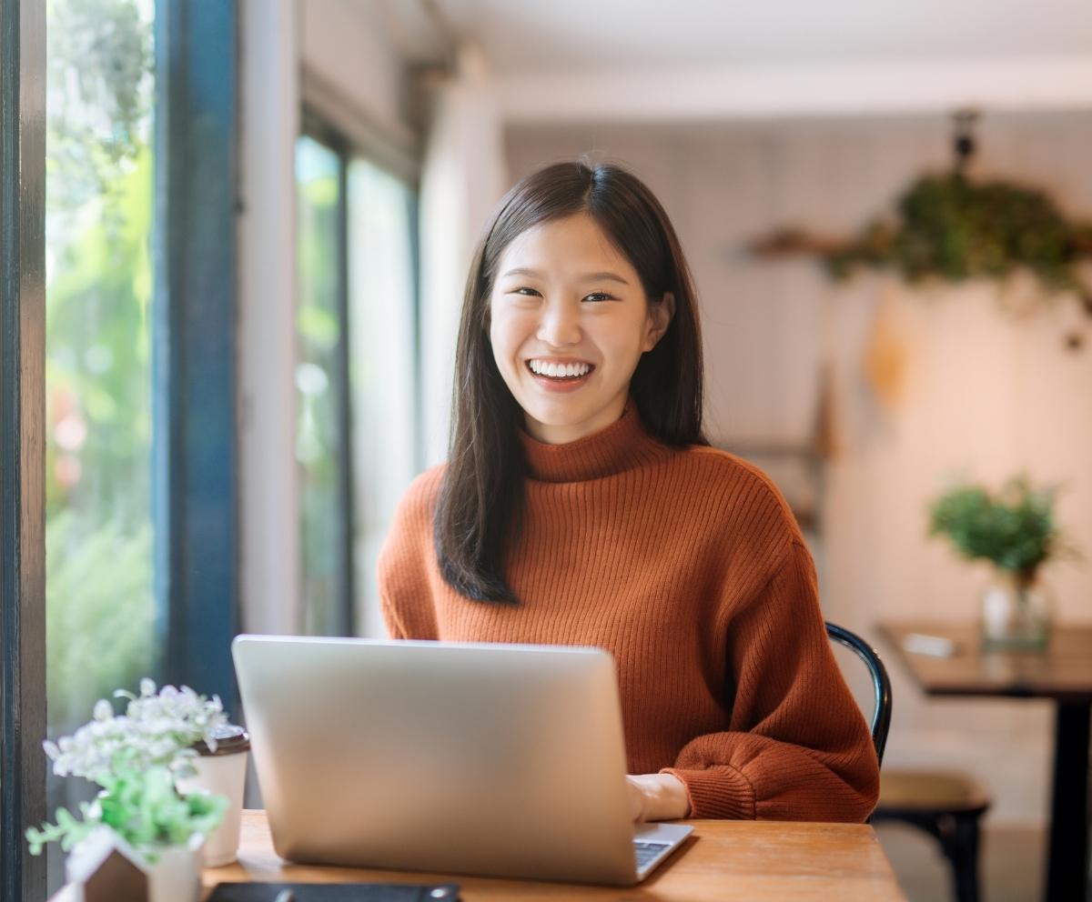 Woman using online banking to explore fixed-rate Certificate of Deposit options
