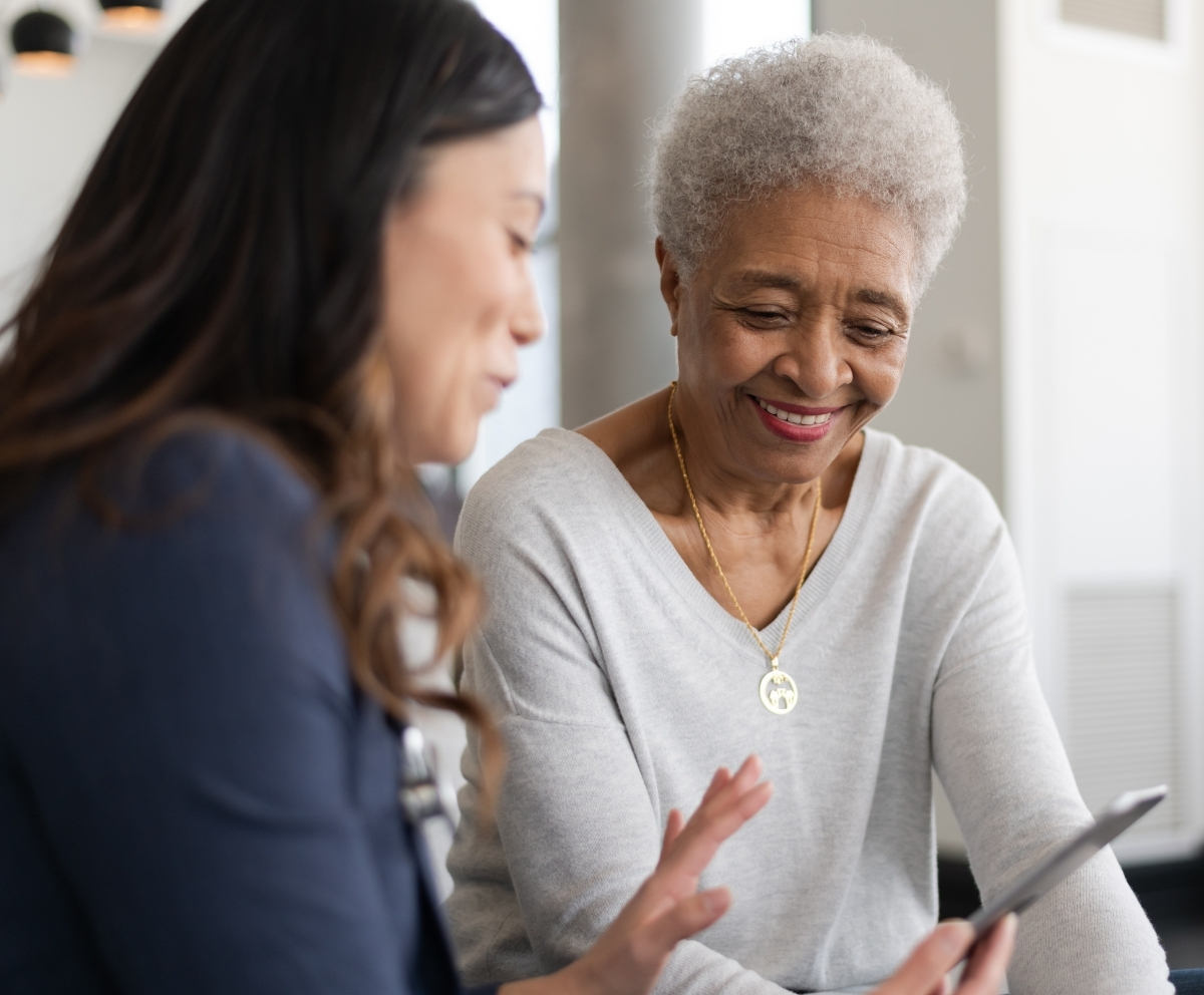 Member reviewing retirement savings options with an advisor on a tablet
