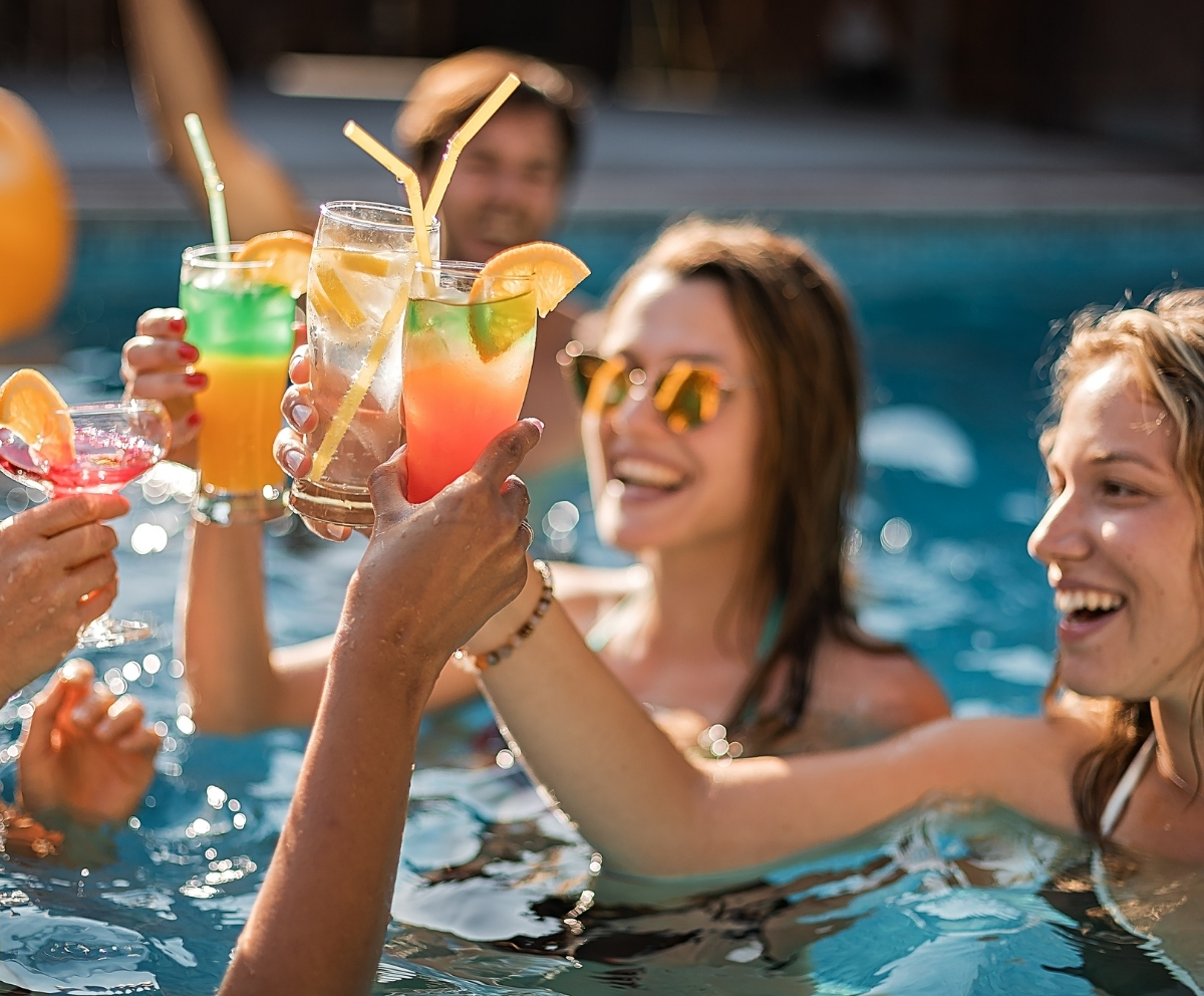 Friends enjoying a pool area after home upgrades funded by home equity