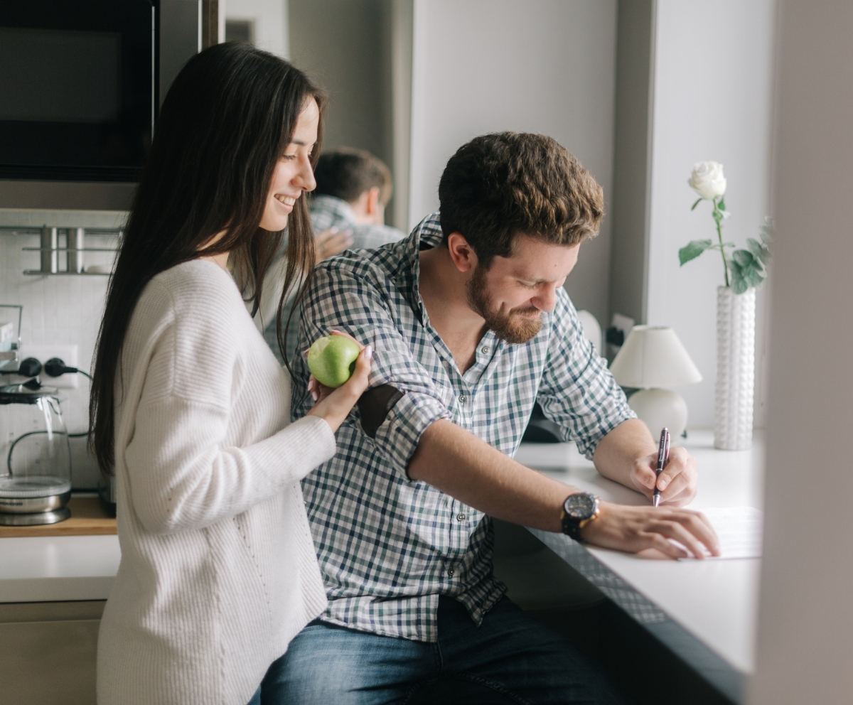 Couple reviewing HELOC paperwork and repayment details at home