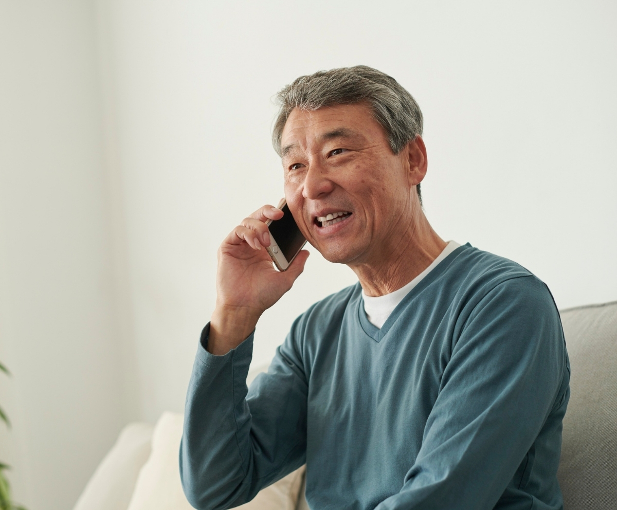 Member using a phone to access Connect Credit Union telephone banking services