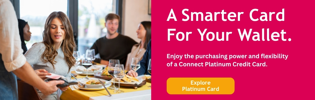 Woman using platinum credit card to pay or dinner with friends at a restaurant